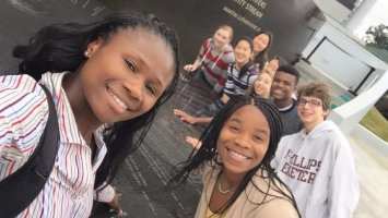 Exeter Physical Education Instructor Olutoyin Augustus-Ikwuakor with students at the Civil Rights Memorial in Montgomery Alabama