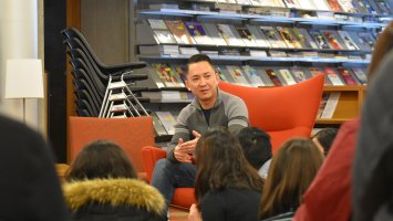 Novelist Viet Thanh Nguyen speaking with students in the library at Exeter