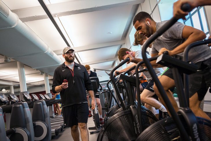 Shaun Fishel works with students in the Downer Fitness Center at Exeter.